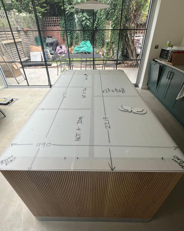 Template film with measurements laid over a kitchen island